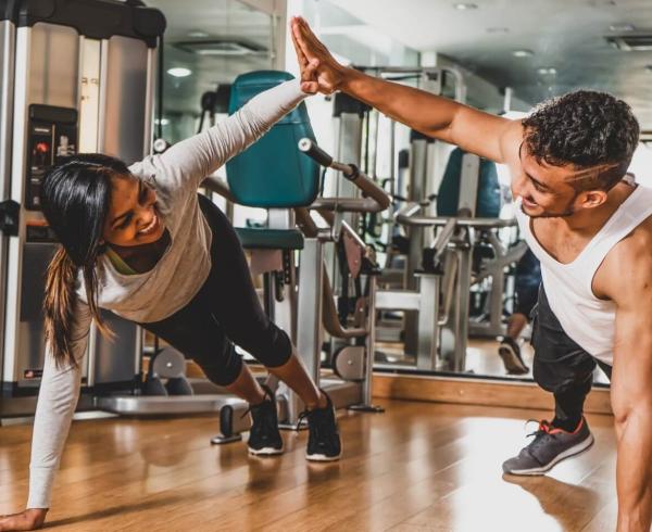 man and woman working out