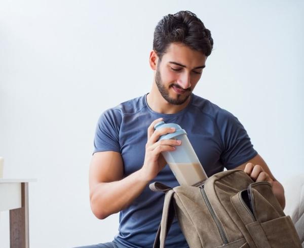 man with protein shake