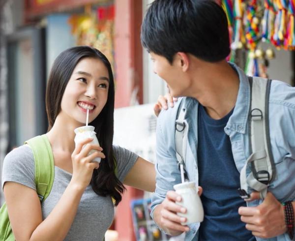 man and woman with beverage