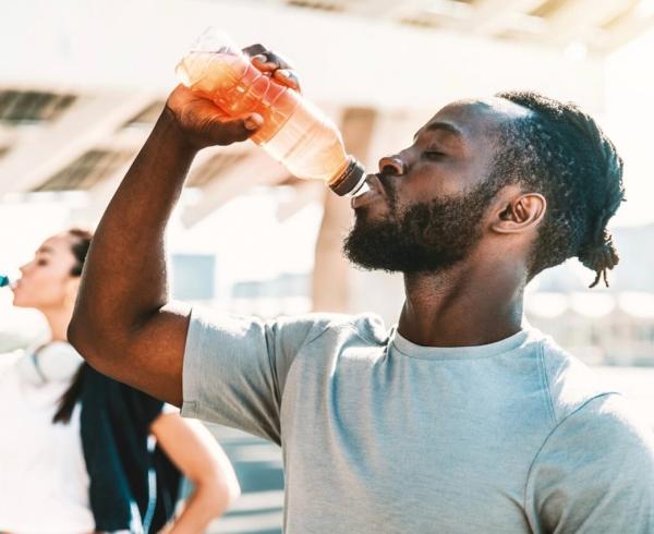 man drinking beverage