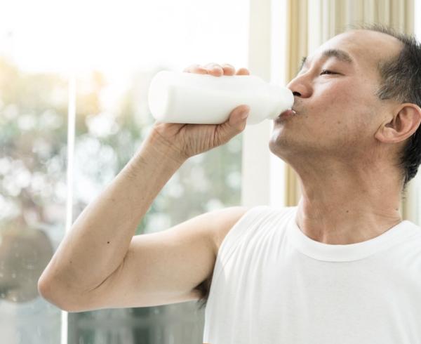 man drinking milk