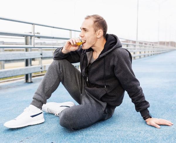 Man eating protein bar