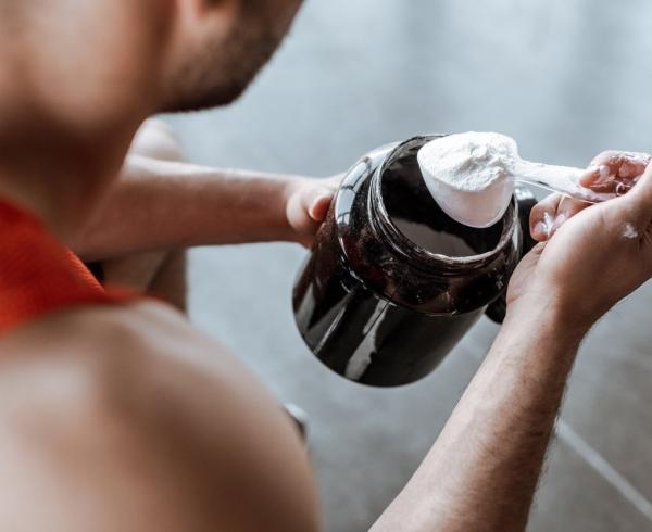 man with protein powder