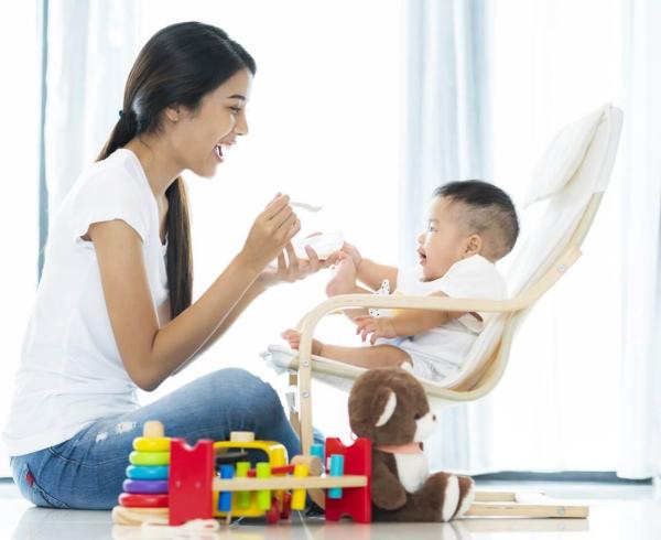 mom playing with baby