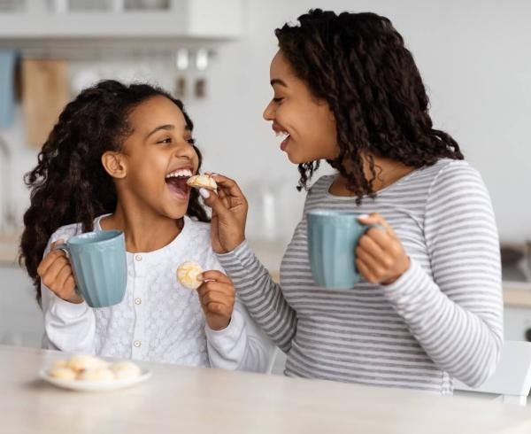 mom and daughter eating cookies