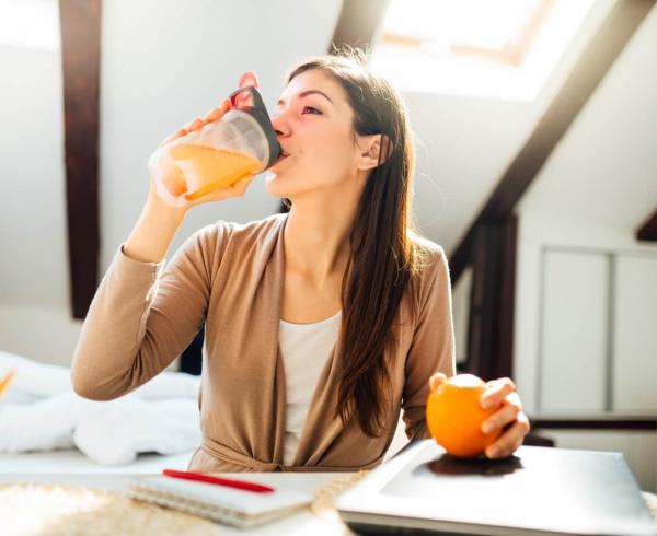 woman drinking premix drink