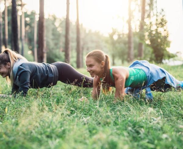 two girls doing push ups