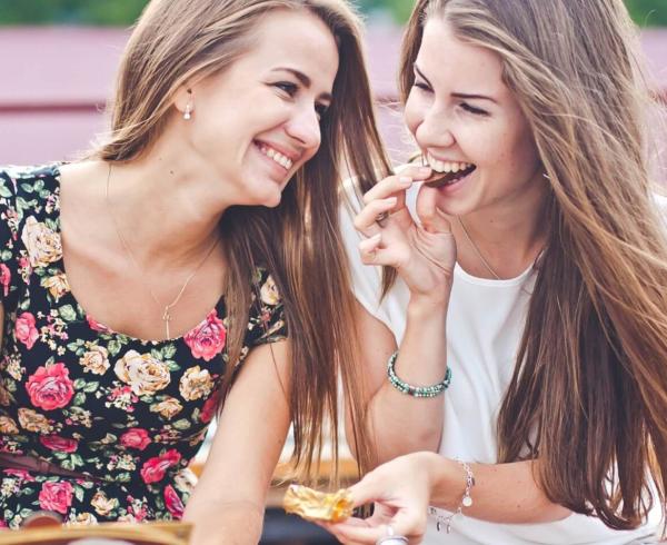 two girls snacking