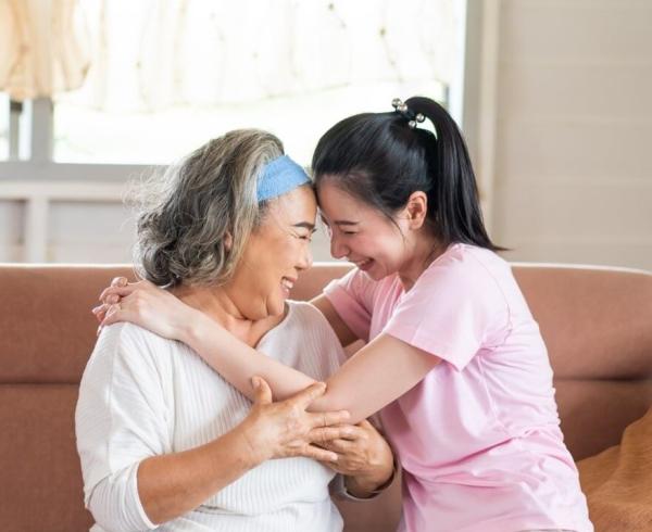 two asian women hugging