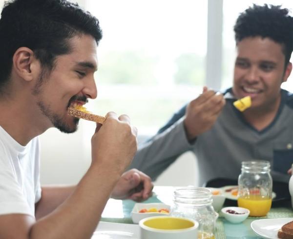 two men eating breakfast