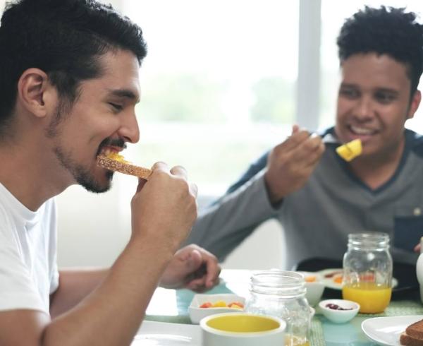 two men eating breakfast