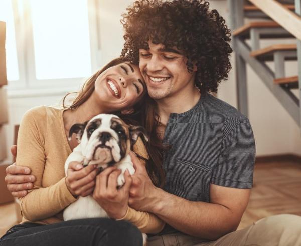 man and woman with dog