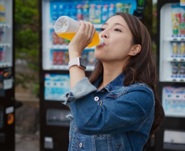 woman drinking beverage