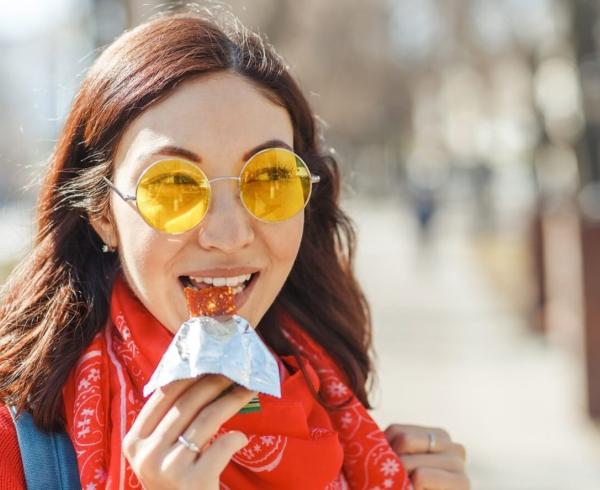 woman eating bar