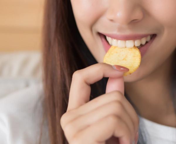 woman eating chip