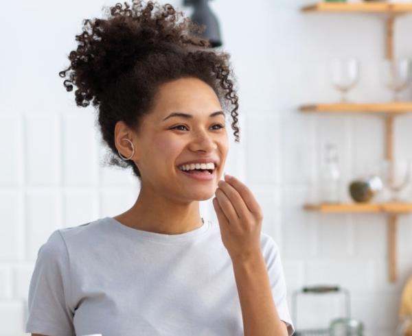 woman taking supplement 