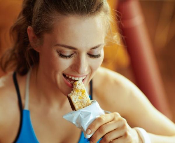 woman eating bar