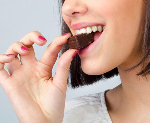 woman eating chocolate