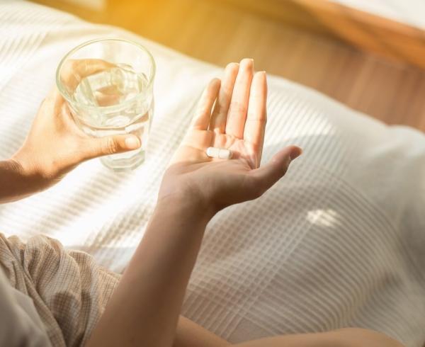 woman holding supplement