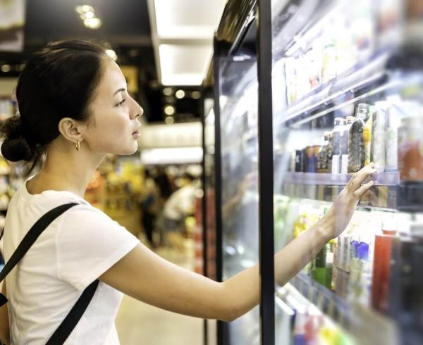 woman looking at beverages