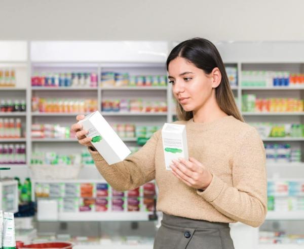 Woman looking at supplements in store