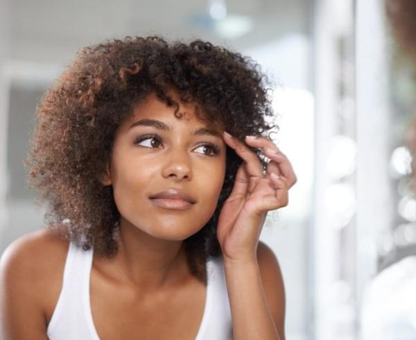 woman looking in mirror