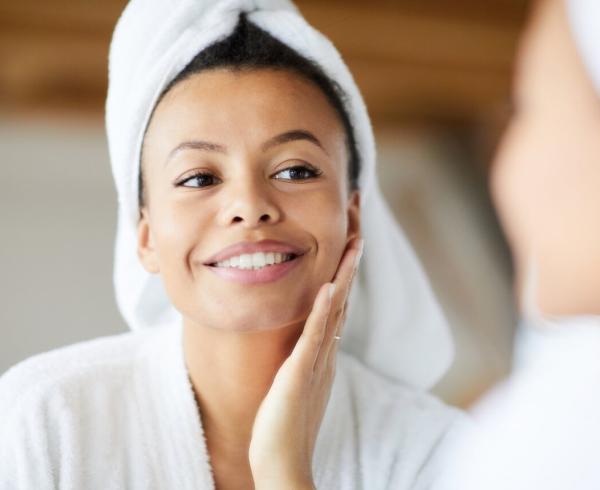 woman looking in mirror