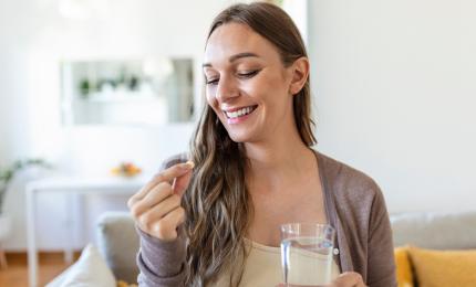 woman holding supplement